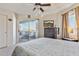 Bright bedroom with balcony access and a ceiling fan at 1720 E Thunderbird Rd # 2090, Phoenix, AZ 85022