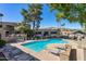Community pool featuring lounge seating, a pool, a spa, and a grass area at 1720 E Thunderbird Rd # 2090, Phoenix, AZ 85022
