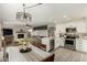 Modern kitchen and connected dining area with an open living room layout at 1883 E Tremaine Ave, Gilbert, AZ 85234