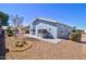 Exterior showcasing rock landscaping, covered patio, and a view of the well-maintained home at 2263 N Trekell Rd # 21, Casa Grande, AZ 85122