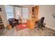 Comfortable office space with a glass desk, plush chair, ample lighting and neutral decor at 2263 N Trekell Rd # 21, Casa Grande, AZ 85122