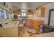 Cozy office with wood stove, desk, cabinets, and built-in desk at 2263 N Trekell Rd # 21, Casa Grande, AZ 85122