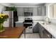 Stylish kitchen features stainless steel appliances, gray cabinets, and quartz countertops at 2277 S Apache Dr # 7, Apache Junction, AZ 85120