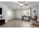 Bright living room featuring tile floors, ceiling fan, comfortable sofa, and lots of natural light at 2277 S Apache Dr # 7, Apache Junction, AZ 85120