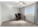 A bright office space with a large window, desk, and neutral tones at 2277 S Apache Dr # 7, Apache Junction, AZ 85120