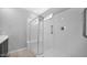 Bathroom featuring a glass-enclosed walk-in shower at 2296 S 235Th Dr, Buckeye, AZ 85326