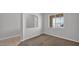 Bright bedroom with large window, neutral carpet, and adjacent archway for an open feel at 2296 S 235Th Dr, Buckeye, AZ 85326