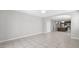 Spacious living room that flows into the kitchen with stainless steel appliances at 2296 S 235Th Dr, Buckeye, AZ 85326