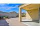 This covered patio features a ceiling fan, brick-paved area and views of the backyard at 2296 S 235Th Dr, Buckeye, AZ 85326