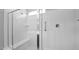 Modern bathroom shower with a glass door and built in bench at 2296 S 235Th Dr, Buckeye, AZ 85326