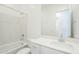 Clean bathroom featuring a tub with shower, modern sink, and neutral décor at 23146 E Nightingale Rd, Queen Creek, AZ 85142