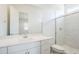 Sleek bathroom with a walk-in shower, quartz countertops, and modern fixtures at 23146 E Nightingale Rd, Queen Creek, AZ 85142