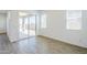 Bright bedroom featuring a sliding glass door that leads to outdoor space and tiled floors at 23146 E Nightingale Rd, Queen Creek, AZ 85142
