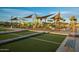Inviting community park featuring playground equipment, bocce ball court and shaded picnic areas at 23146 E Nightingale Rd, Queen Creek, AZ 85142