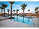 Beautiful community pool area with shaded lounge chairs and a pool-side ramada at 23146 E Nightingale Rd, Queen Creek, AZ 85142