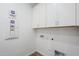 Laundry room featuring neutral walls and overhead cabinets at 23146 E Nightingale Rd, Queen Creek, AZ 85142