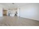 Open concept living area with tiled floors and lots of natural light at 23146 E Nightingale Rd, Queen Creek, AZ 85142