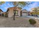 Charming single-story home featuring desert landscaping, a two-car garage, and a stucco exterior at 2521 W Mark Ln, Phoenix, AZ 85085