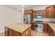 Modern kitchen with stainless steel appliances, granite countertops, and a kitchen island with seating at 2521 W Mark Ln, Phoenix, AZ 85085
