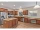 Spacious kitchen with stainless steel appliances, a large island, and warm wood cabinets at 2521 W Mark Ln, Phoenix, AZ 85085