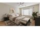 Light and airy bedroom featuring a large window, neutral colors, and modern decor accents at 2521 W Mark Ln, Phoenix, AZ 85085