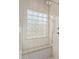 Shower features a clear glass block window and a built-in bench at 2521 W Mark Ln, Phoenix, AZ 85085