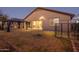 This backyard is perfect for entertaining guests and hosting barbecues, with a patio and covered seating area at 25330 N 134Th Dr, Peoria, AZ 85383