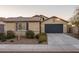 Charming single-story home with a two-car garage, desert landscaping, and a tile roof at 25330 N 134Th Dr, Peoria, AZ 85383