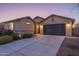 Beautiful single-story home with a two-car garage, desert landscaping, and a welcoming entrance at 25330 N 134Th Dr, Peoria, AZ 85383