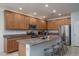 Spacious kitchen with granite countertops, stainless steel appliances, ample cabinetry, and a kitchen island at 25330 N 134Th Dr, Peoria, AZ 85383