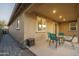This is a beautiful patio and outdoor living space with a table and chairs, perfect for enjoying the weather with Gathering or friends at 25330 N 134Th Dr, Peoria, AZ 85383