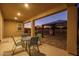Inviting covered patio featuring outdoor seating and view of the landscaped backyard with gazebo, ideal for relaxation and entertaining at 25330 N 134Th Dr, Peoria, AZ 85383