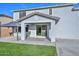 Backyard view showing a covered patio with a sliding glass door at 25756 N 140Th Ln, Surprise, AZ 85387