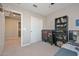 Cozy bedroom features a closet and a view to the laundry room at 25756 N 140Th Ln, Surprise, AZ 85387