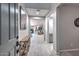 Inviting entryway featuring light gray walls, tile floors, and an open view into the spacious living areas at 25756 N 140Th Ln, Surprise, AZ 85387