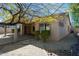 Charming exterior view showcasing a covered patio and beautiful desert landscaping at 27127 N 54Th Ave, Phoenix, AZ 85083