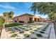 A backyard featuring a pool, patio, pavers, and manicured landscaping at 2799 E Jade Pl, Chandler, AZ 85286