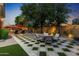 An outdoor patio features travertine flooring, a seating area and view of the pool at 2799 E Jade Pl, Chandler, AZ 85286