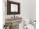Powder bathroom with vessel sink, framed mirror, and toilet at 2799 E Jade Pl, Chandler, AZ 85286