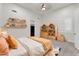 Bright bedroom featuring built-in shelves, a playful rug, and ample storage space at 2799 E Jade Pl, Chandler, AZ 85286