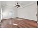Bright bedroom features wood floors, tray ceiling, ceiling fan, and plantation shutters at 2799 E Jade Pl, Chandler, AZ 85286