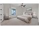 Serene bedroom with neutral tones, a large window, and comfortable furnishings at 2799 E Jade Pl, Chandler, AZ 85286