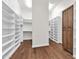 Well-organized walk-in closet featuring custom shelving units and ample storage space at 2799 E Jade Pl, Chandler, AZ 85286
