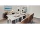 Elegant dining room with a marble table, stylish chairs, and modern decor at 2799 E Jade Pl, Chandler, AZ 85286
