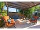 Relaxing outdoor fire pit lounge area, equipped with ample seating and charming water feature at 2799 E Jade Pl, Chandler, AZ 85286