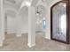 Bright foyer featuring an ornate front door, marble flooring, and an arched entryway at 2799 E Jade Pl, Chandler, AZ 85286