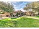 Charming one-story home featuring a tile roof, manicured lawn, and mature landscaping at 2799 E Jade Pl, Chandler, AZ 85286