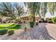 Spacious three-car garage with mature landscaping and a long, paved driveway at 2799 E Jade Pl, Chandler, AZ 85286