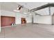 Spacious three-car garage with work bench, built in storage, and automatic doors at 2799 E Jade Pl, Chandler, AZ 85286