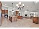 Open-concept kitchen boasts granite countertops, custom cabinetry, and a large island perfect for entertaining at 2799 E Jade Pl, Chandler, AZ 85286